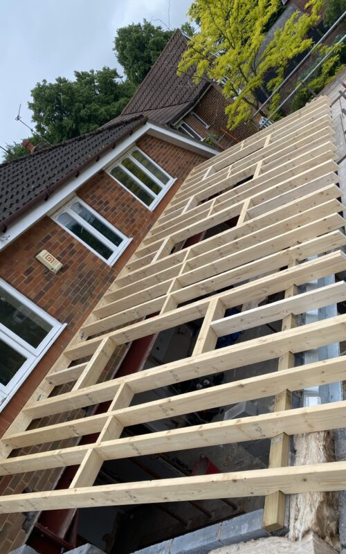 New roof with 4 velux windows in on the rear of a house extension done by Revitalise Interiors LTD