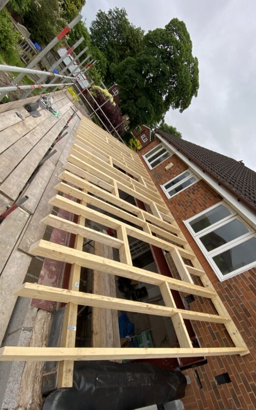 New roof with 4 velux windows in on a rear house extension